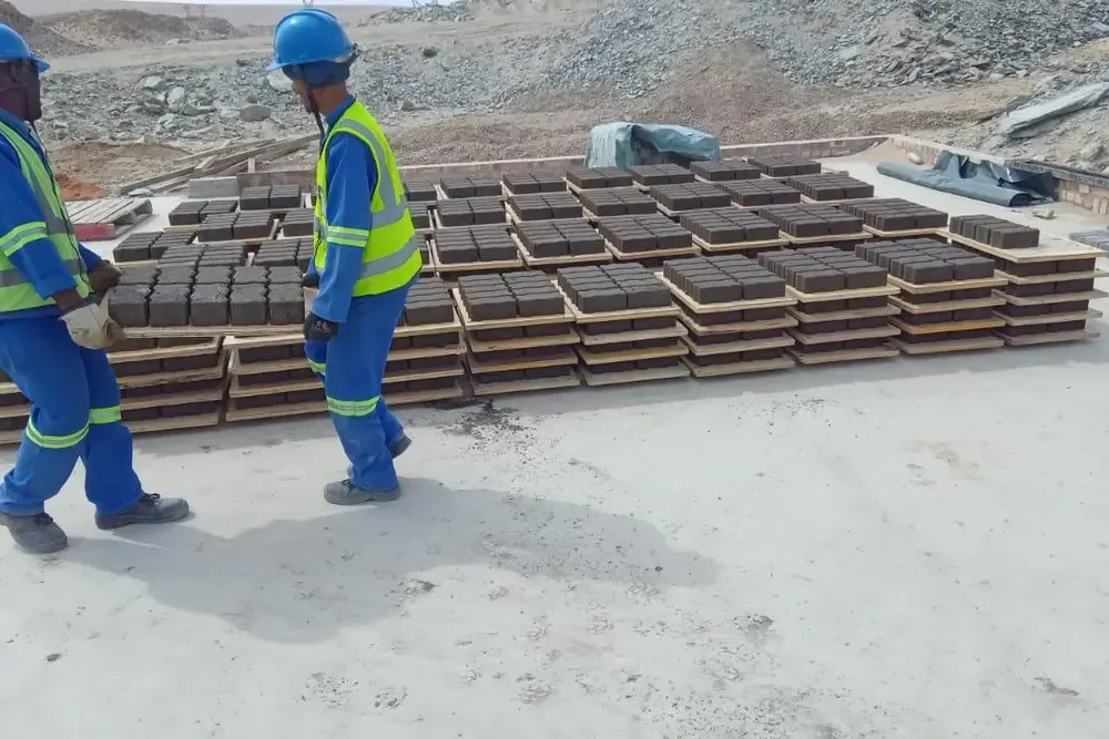 Workers carrying Hydraform blocks during onsite training